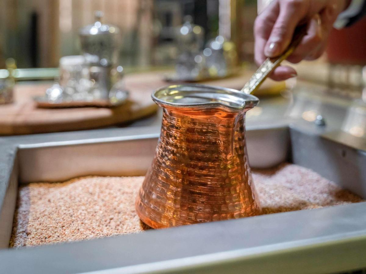 Mercure Trabzon Hotel Екстериор снимка Turkish coffee being prepared in a cezve